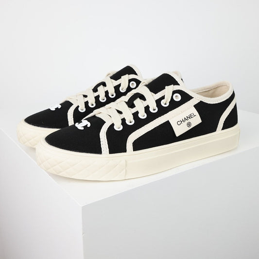 Chanel Limited Edition Low-Top Canvas Sneakers – Black & White with CC Logo Patch