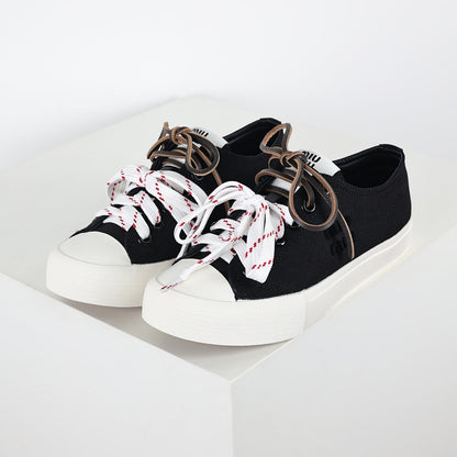 Miu Miu Canvas Low-Top Sneakers in Black