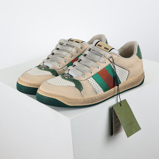 Gucci Screener Low-Top Sneakers – Distressed Leather with Green Trim & Web Stripe