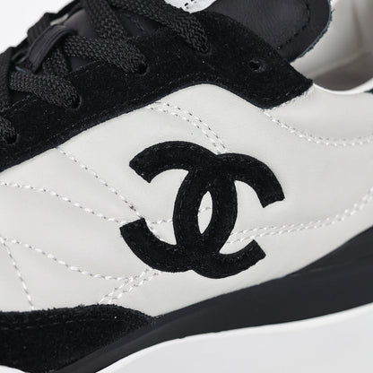 Chanel CC Logo Runner Sneakers – White Quilted Leather & Black Suede
