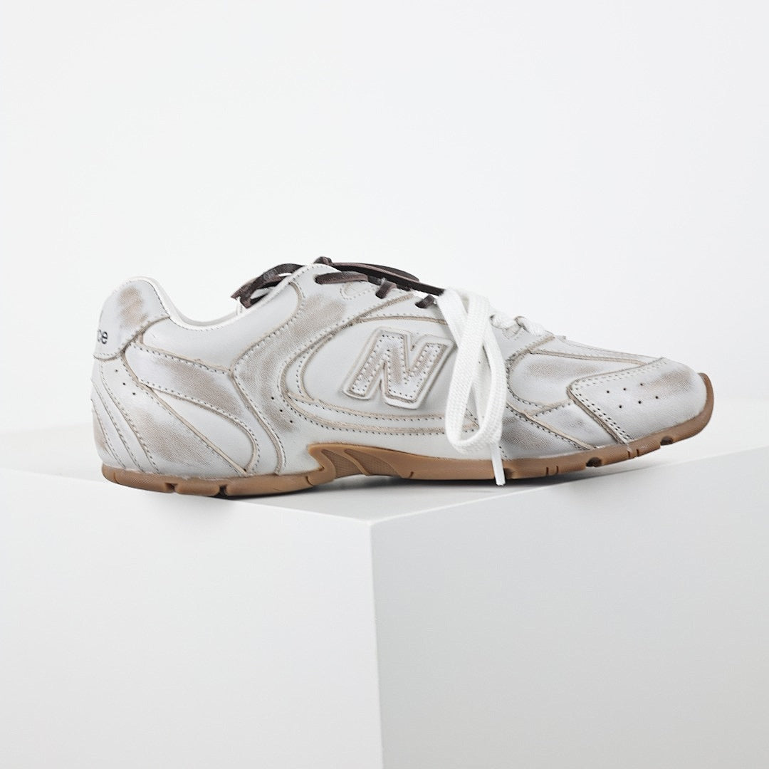 Miu Miu x New Balance 2002R Retro Sneakers in White