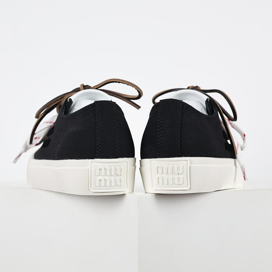 Miu Miu Canvas Low-Top Sneakers in Black