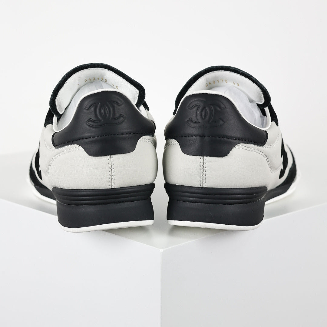 Chanel CC Logo Runner Sneakers – White Quilted Leather & Black Suede