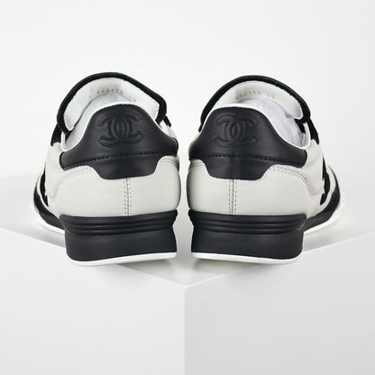 Chanel CC Logo Runner Sneakers – White Quilted Leather & Black Suede