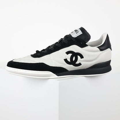 Chanel CC Logo Runner Sneakers – White Quilted Leather & Black Suede