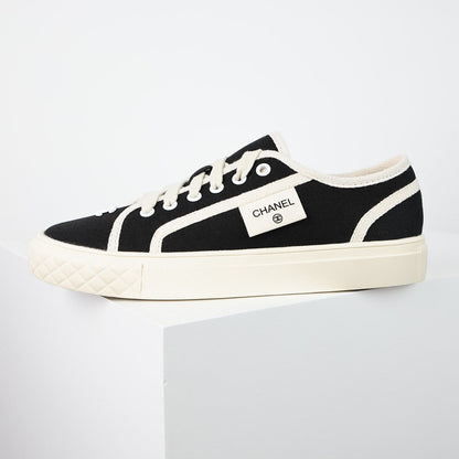 Chanel Limited Edition Low-Top Canvas Sneakers – Black & White with CC Logo Patch