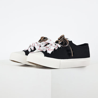 Miu Miu Canvas Low-Top Sneakers in Black